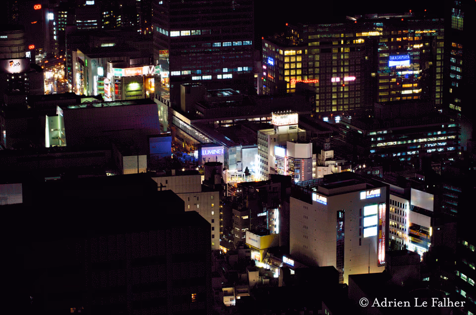 a city at night with buildings lit up
