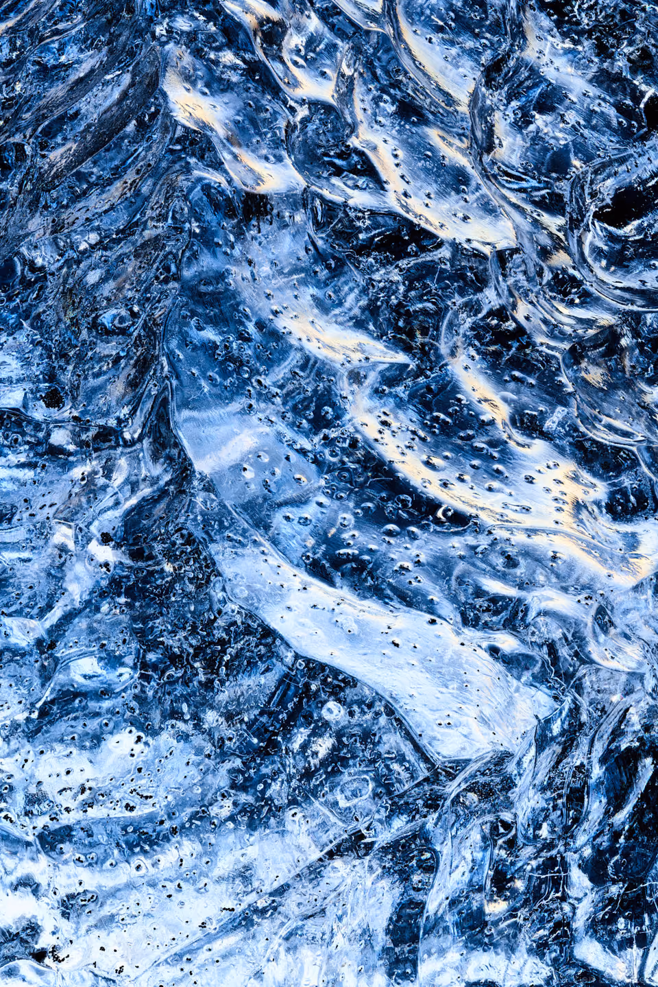 a close up of a blue and white ice
