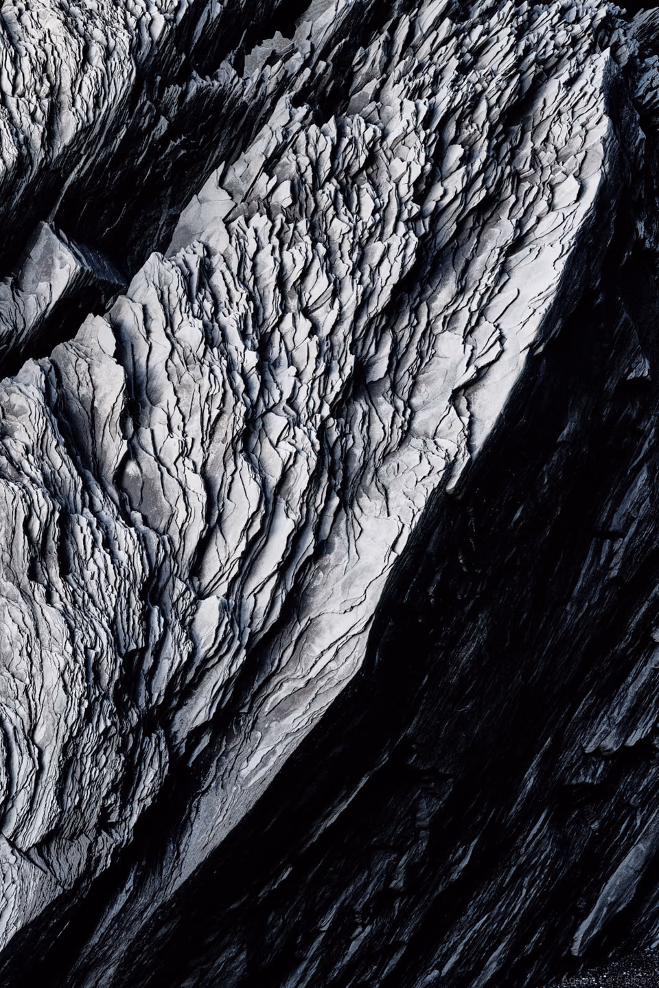 a black and white photo of a mountain

