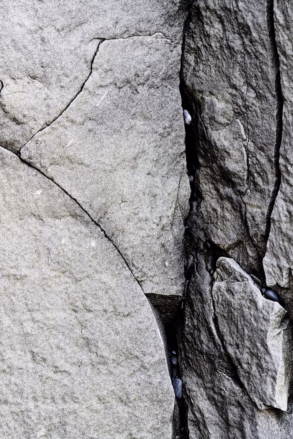 a close up of a rock with cracks
