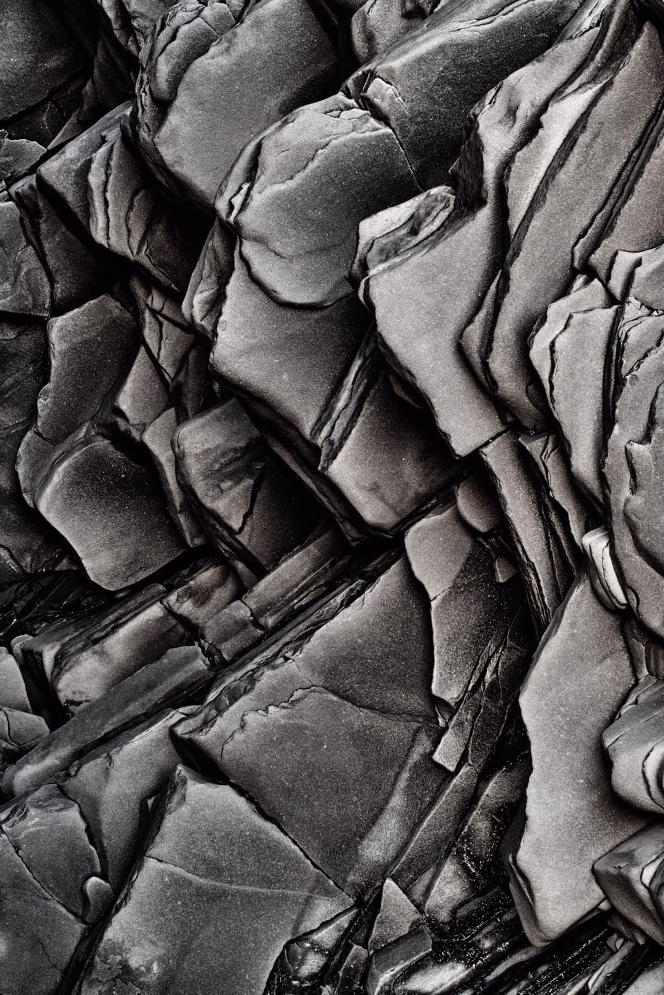 black and white photograph of rocks in the desert
