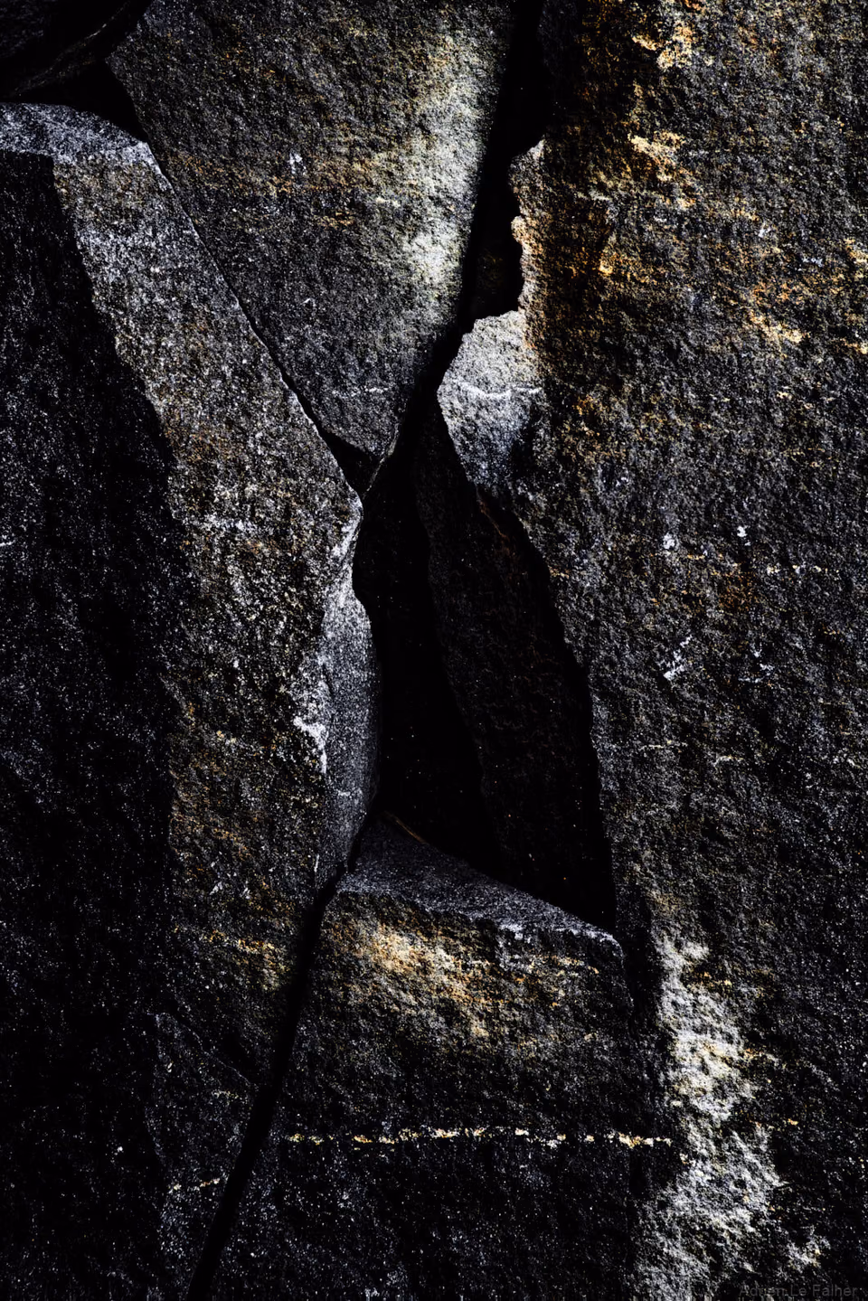 a close up of a rock with a hole in it
