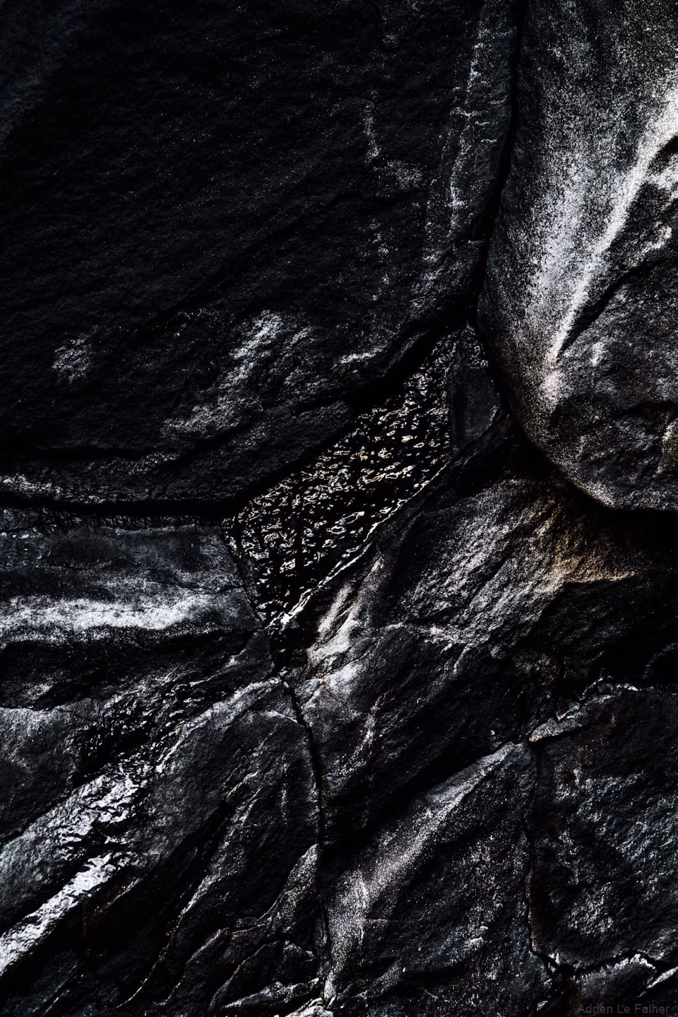 a close up of a black and white photo of a rock
