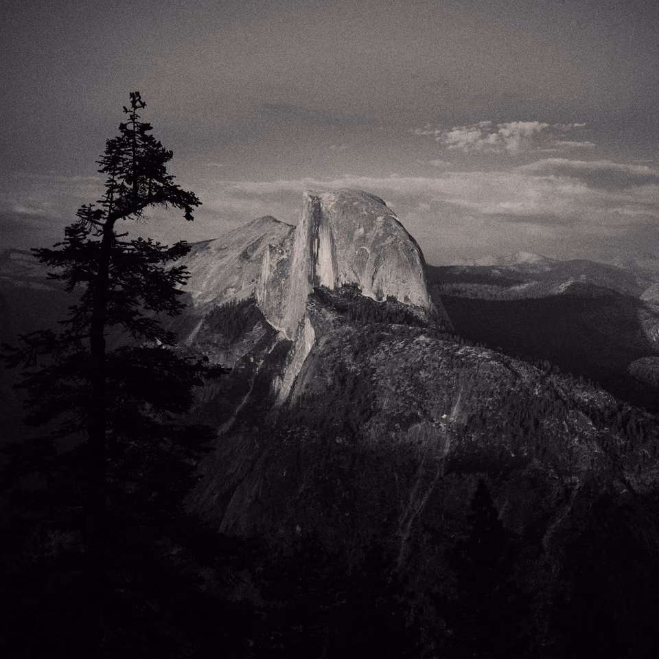 black and white photo of half dome in yosemite
