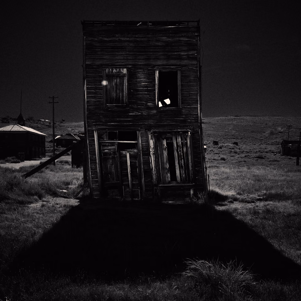 a black and white photo of an old house
