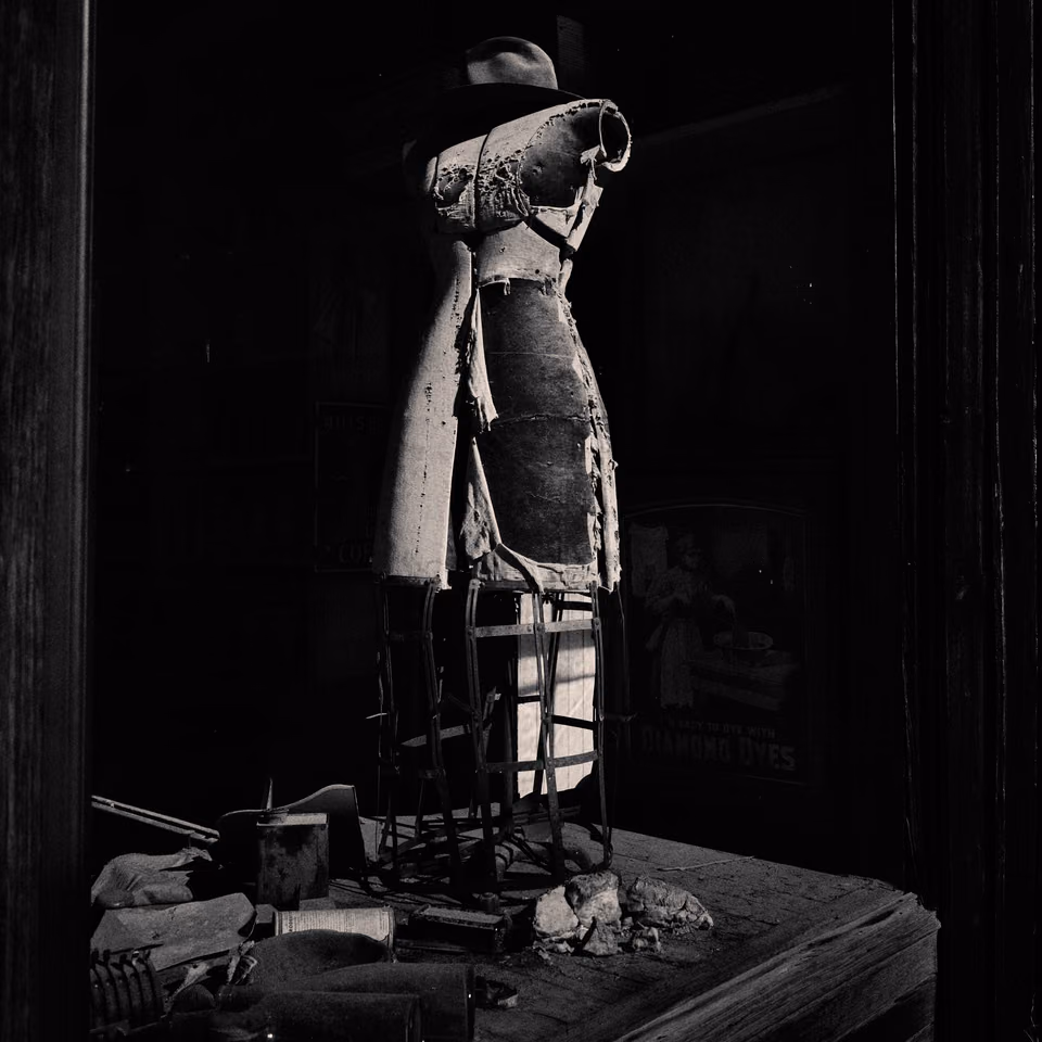 a black and white photo of a mannequin
