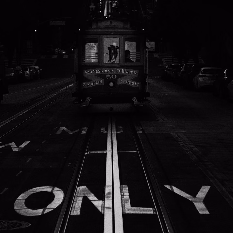 a black and white photo of a cable car
