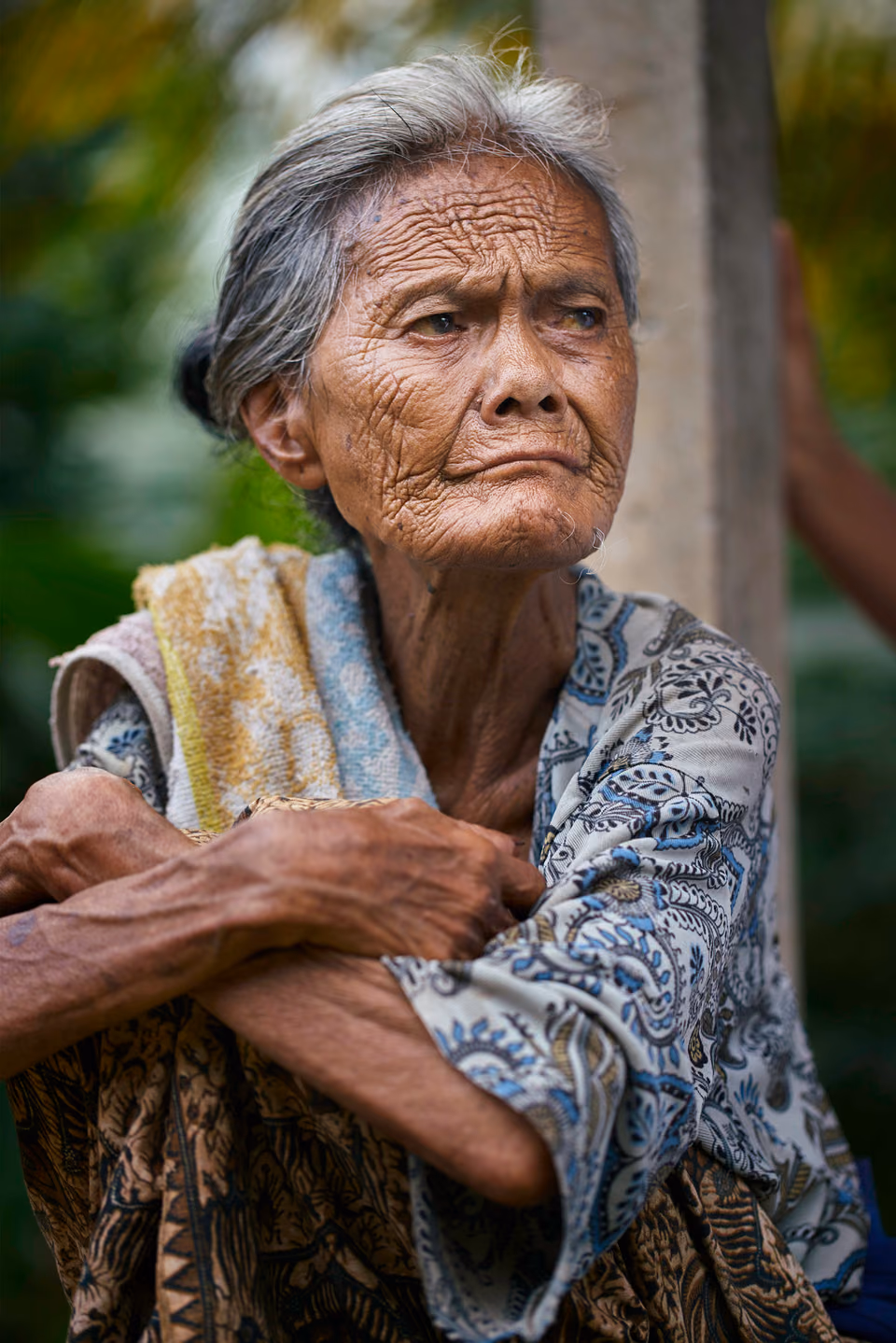 an old woman with wrinkles on her face
