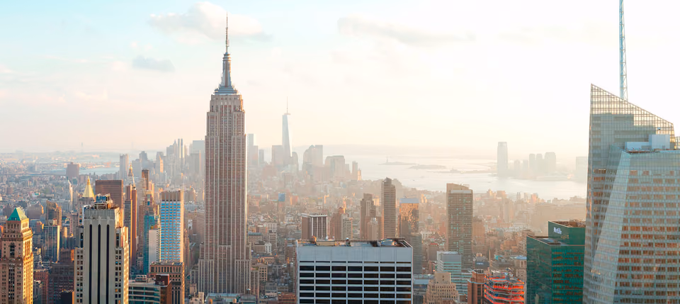 a view of a city skyline with a large building in the middle
