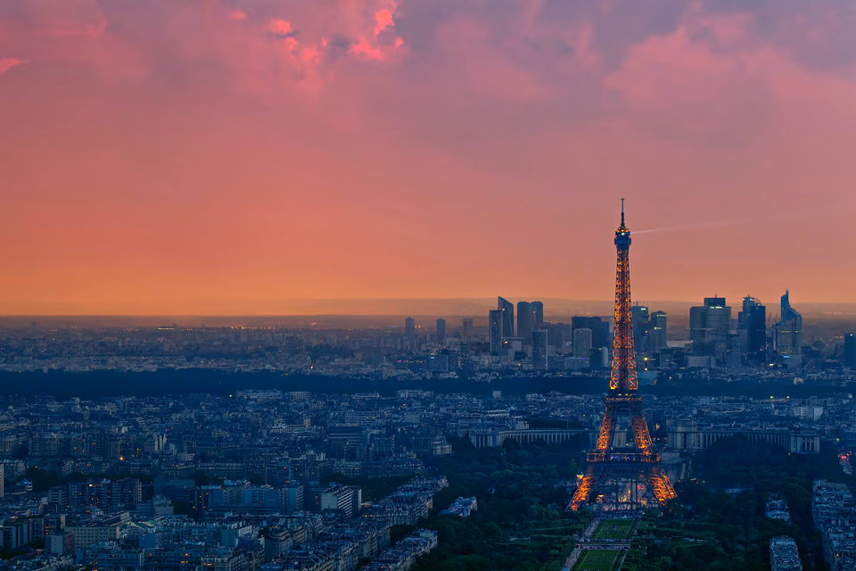 a city skyline with a tower
