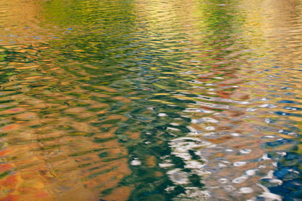 a reflection of a boat in the water
