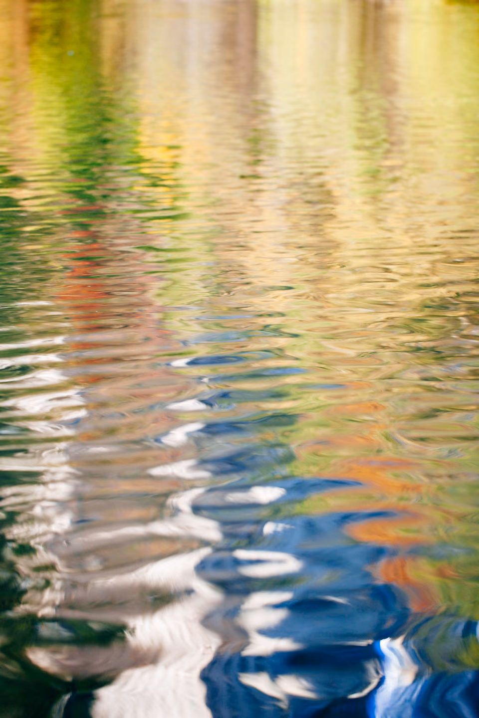 a reflection of a boat in the water
