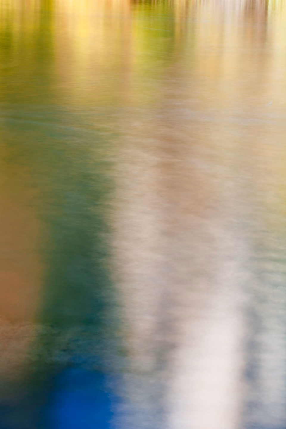 a blurry image of a person standing in the water
