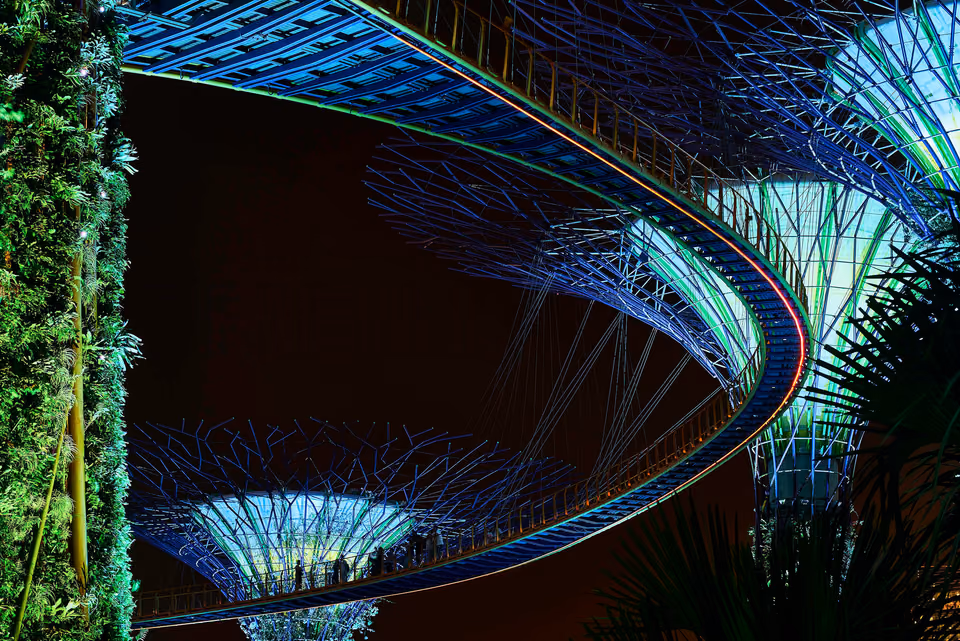 a night scene of a futuristic looking structure

