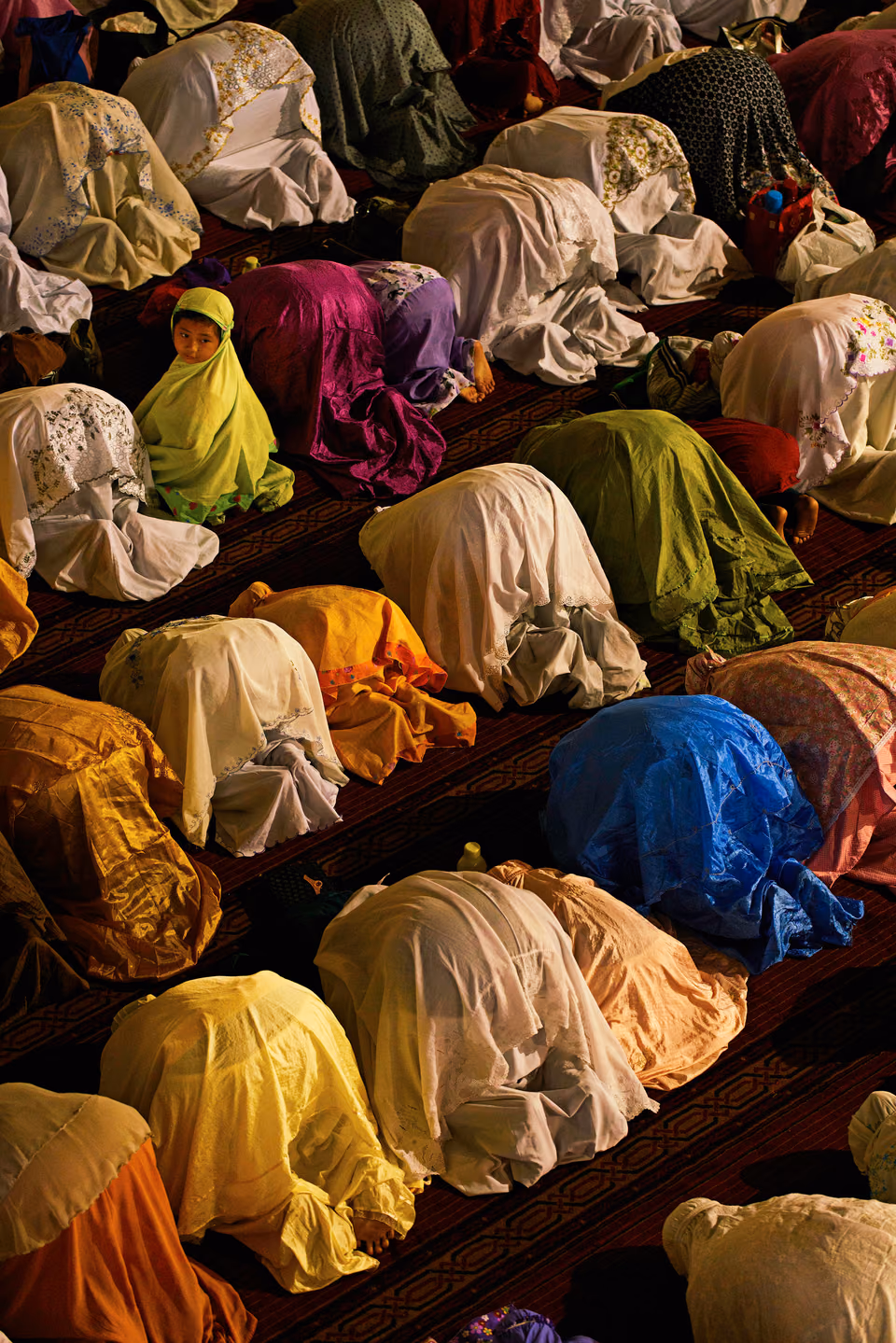 a group of people sitting on the floor
