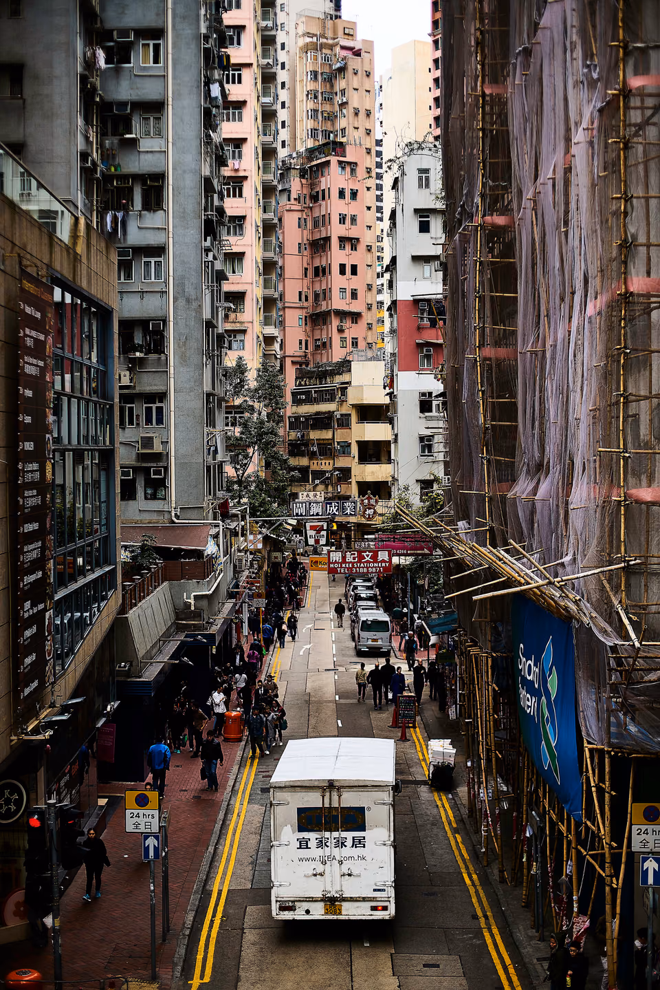 a bus is driving down a city street
