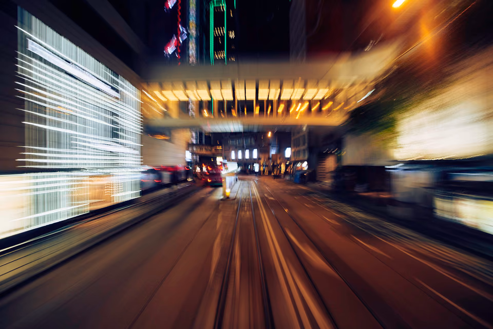 a blurry picture of a city street at night
