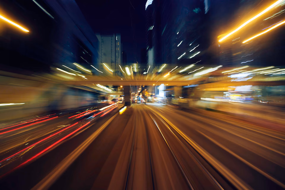 a blurry picture of a city street at night
