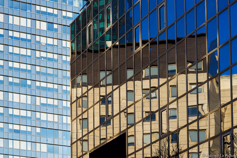 a building with a reflection of another building
