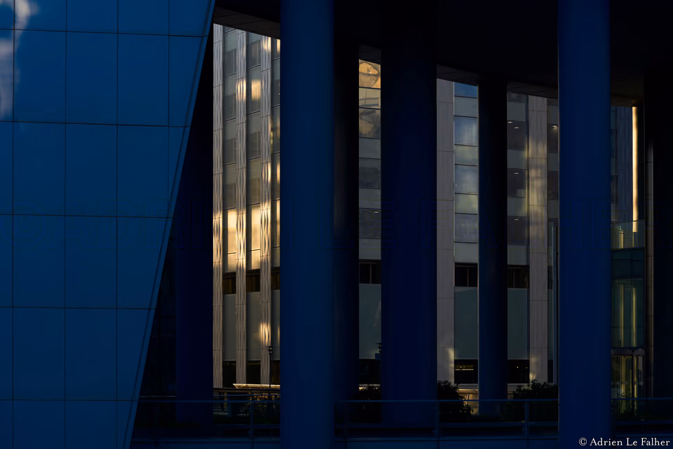 a clock is on a building with a blue sky
