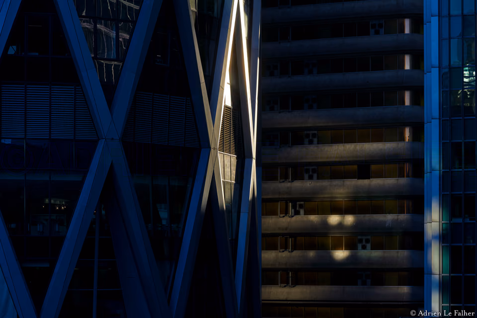 a building with a clock on it next to a building with a clock on it
