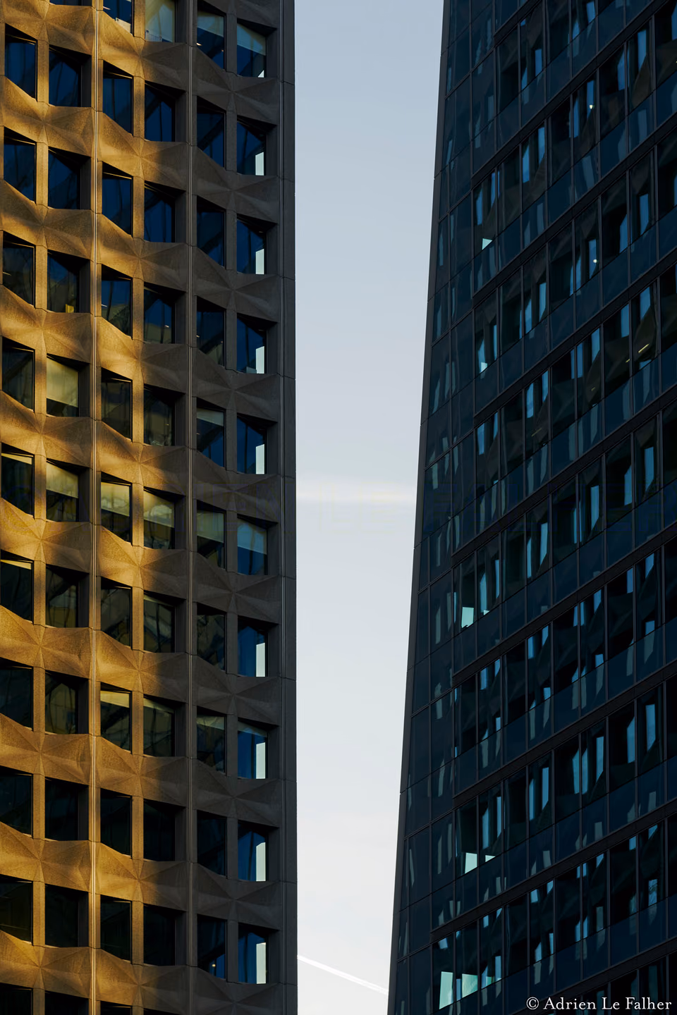 a tall building with windows and a clock
