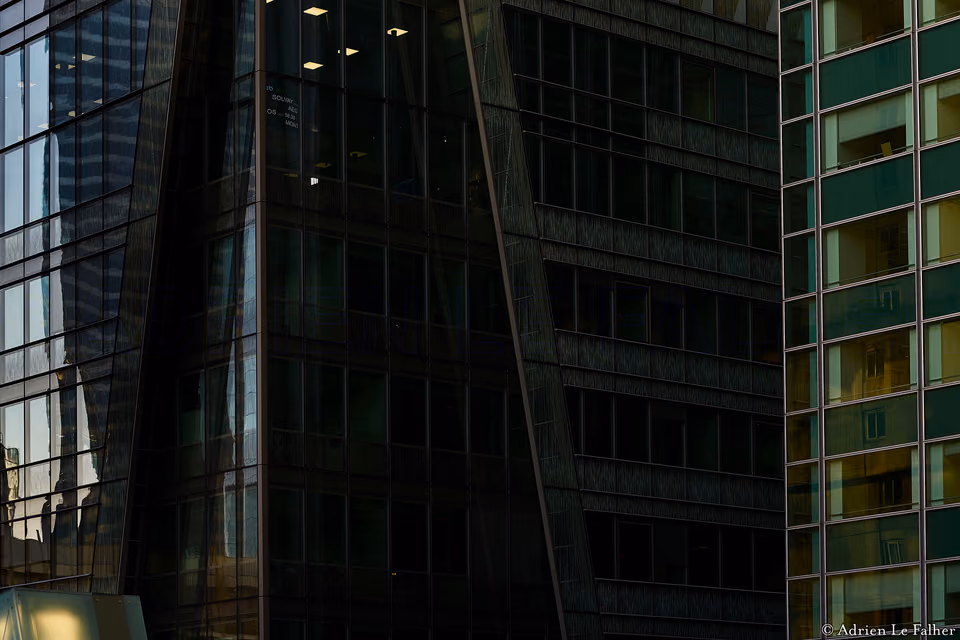 a clock is on a building next to a clock tower
