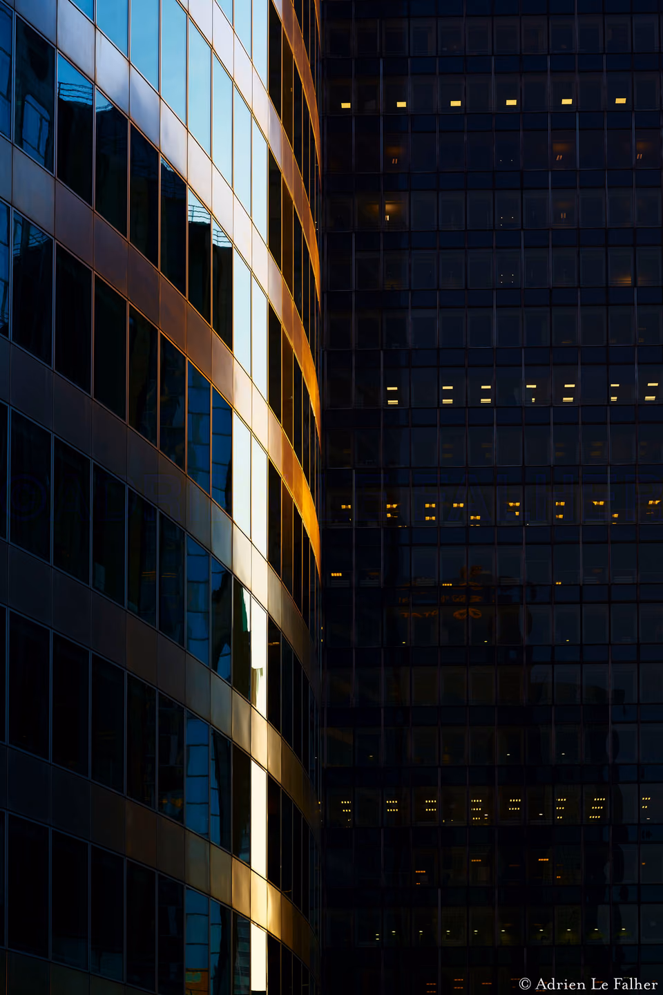 a large building with a reflection of a building in the window
