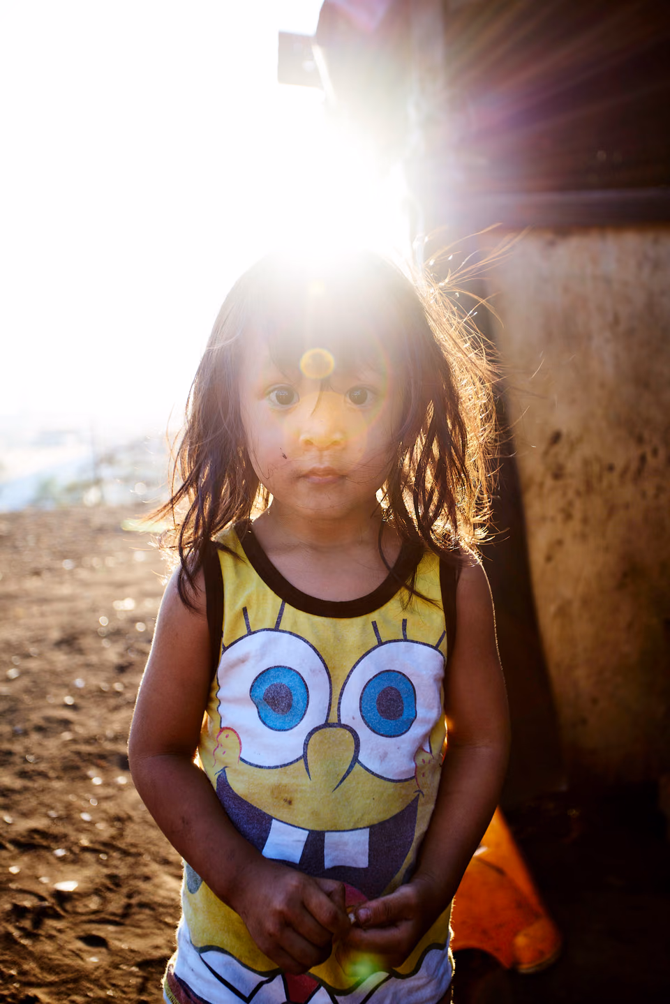 a little girl with a spongebob shirt on
