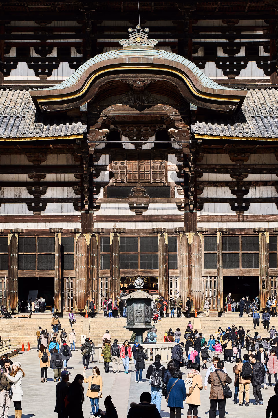 a large building with a lot of people outside
