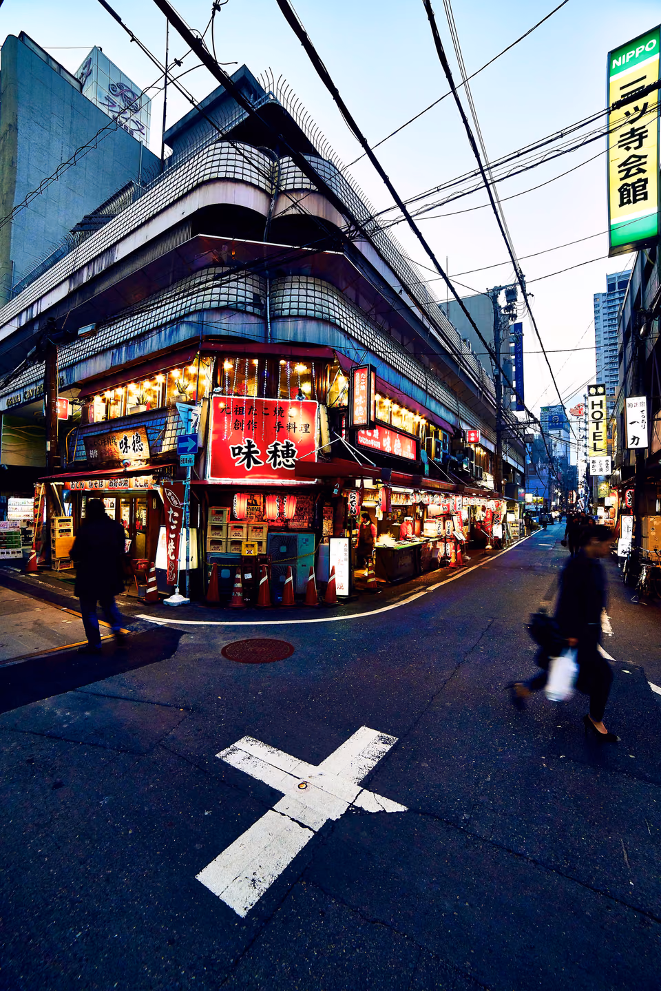 a crosswalk with a pedestrian crossing the street
