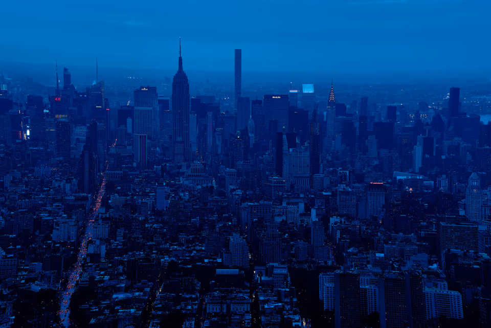 a city skyline with a blue sky
