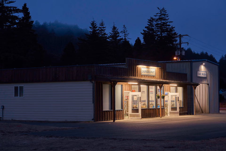 a building with a light on it at night
