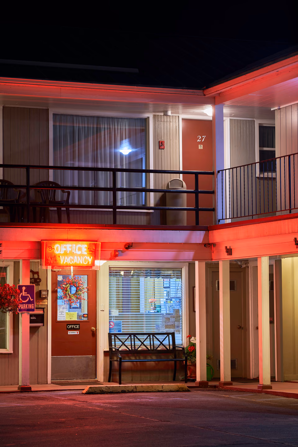 a motel with a balcony
