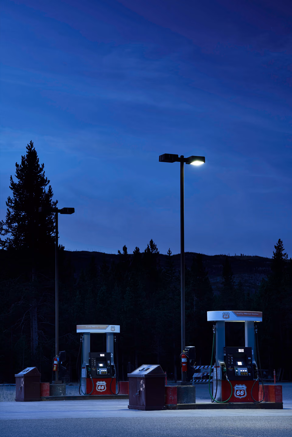 a gas station with a sign
